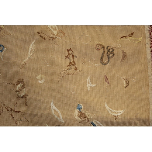 427 - Antique bedspread with three appliqued embroidered panels, the natural scrim fields worked in silk t... 