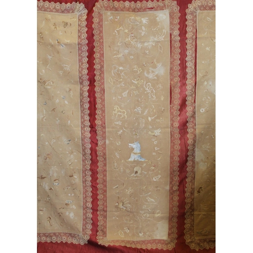 427 - Antique bedspread with three appliqued embroidered panels, the natural scrim fields worked in silk t... 