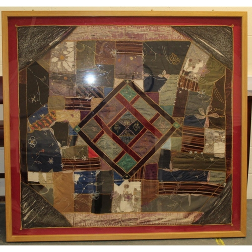 428 - A Victorian 'crazy' pattern patchwork quilt or panel with central diamond lozenge, in polychrome cot... 