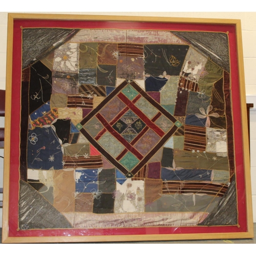 428 - A Victorian 'crazy' pattern patchwork quilt or panel with central diamond lozenge, in polychrome cot... 