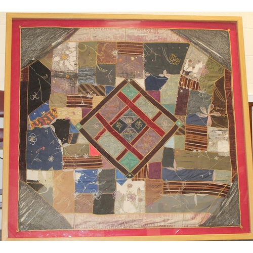 428 - A Victorian 'crazy' pattern patchwork quilt or panel with central diamond lozenge, in polychrome cot... 