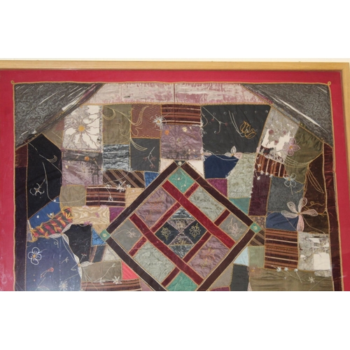 428 - A Victorian 'crazy' pattern patchwork quilt or panel with central diamond lozenge, in polychrome cot... 