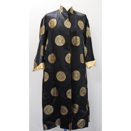 437 - Vintage Chinese reversible black and gold silk coat, with brocade medallions.