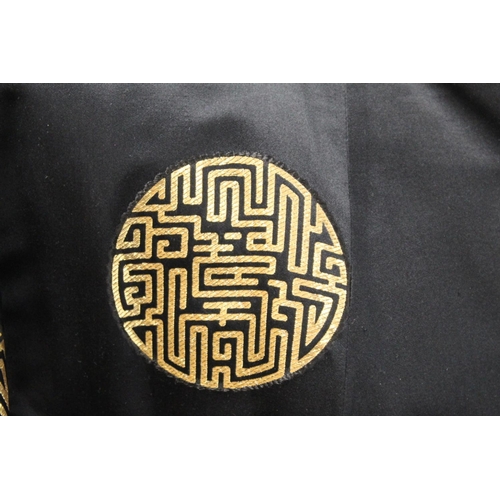 437 - Vintage Chinese reversible black and gold silk coat, with brocade medallions.