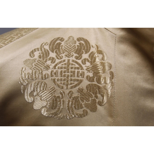 437 - Vintage Chinese reversible black and gold silk coat, with brocade medallions.