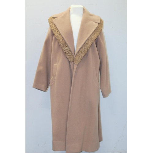 439 - Brenner's vintage lady's camel wool swing coat, with astrakhan wool trim to collar.