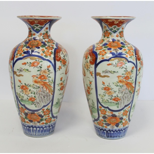 343 - Pair of late 19th/early 20th century large Japanese Imari vases of baluster form decorated with pane... 