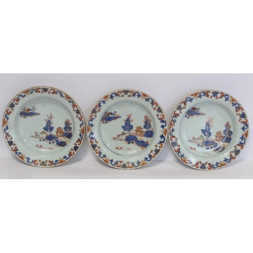 347 - Three 18th century Chinese porcelain soup plates decorated with pagodas in a landscape in underglaze... 