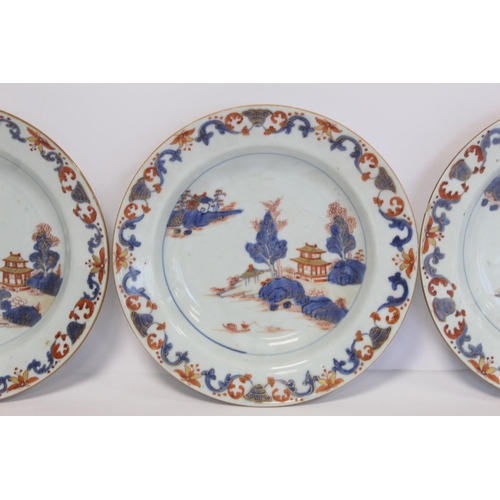 347 - Three 18th century Chinese porcelain soup plates decorated with pagodas in a landscape in underglaze... 