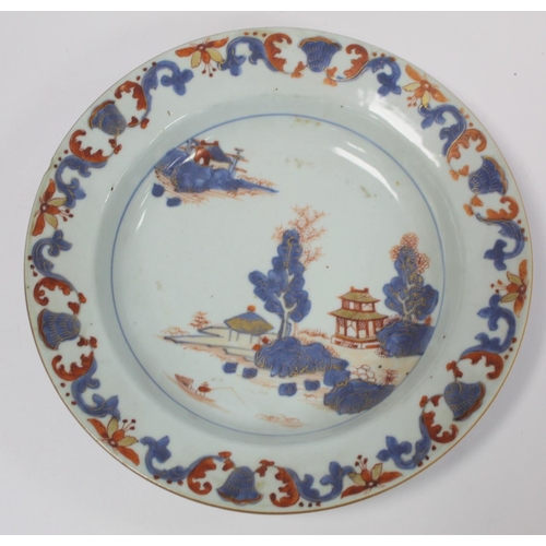 347 - Three 18th century Chinese porcelain soup plates decorated with pagodas in a landscape in underglaze... 