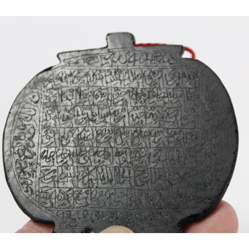 348 - Antique Mughal black hardstone amulet of oval panel form, each side incised with rows of script, 6.5... 