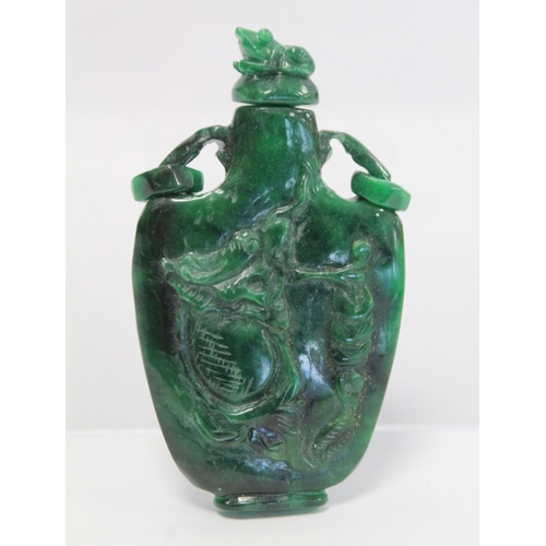 354 - 20th century Chinese dark green mottled jade snuff bottle of flat baluster form with twin ring handl... 