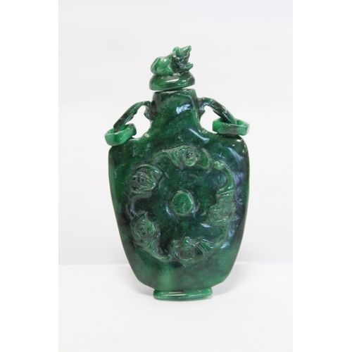 354 - 20th century Chinese dark green mottled jade snuff bottle of flat baluster form with twin ring handl... 