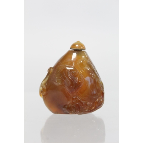 361 - 20th century Chinese dark yellow agate snuff bottle of pear form carved with Chilong with similarly ... 