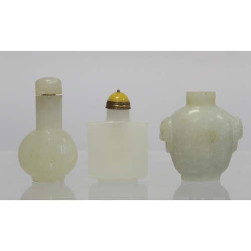 367 - Three Chinese white soapstone snuff bottles: one with twin mask head handles, lacking stopper, 6cm h... 