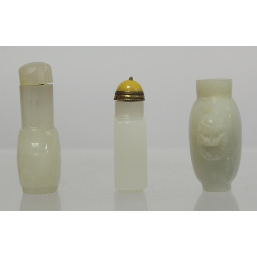 367 - Three Chinese white soapstone snuff bottles: one with twin mask head handles, lacking stopper, 6cm h... 