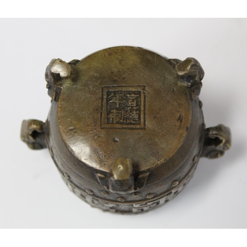 374 - Chinese miniature barrel shaped vessel of censor with twin elephant mask handles and tripod feet, ar... 