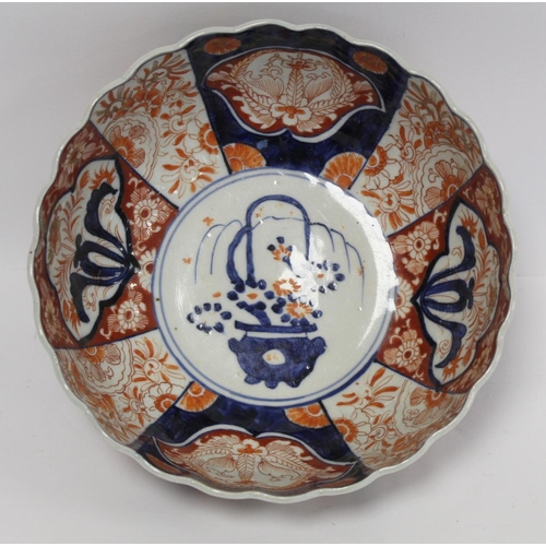 387 - Japanese Meiji period Imari bowl of circular fluted form with circular panel of a vase of flowers su... 