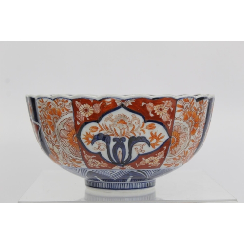 387 - Japanese Meiji period Imari bowl of circular fluted form with circular panel of a vase of flowers su... 