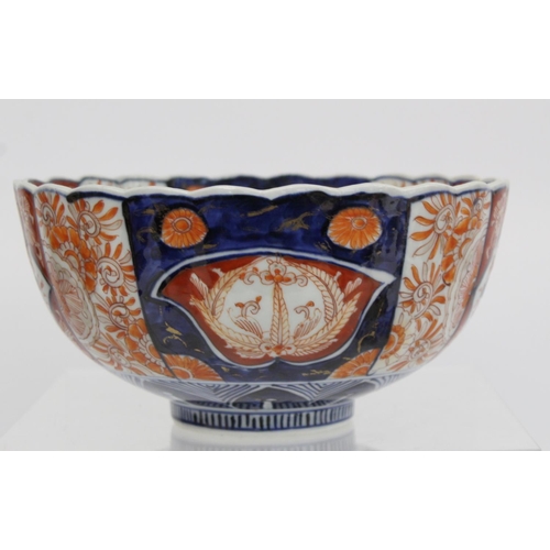 387 - Japanese Meiji period Imari bowl of circular fluted form with circular panel of a vase of flowers su... 