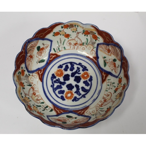 387 - Japanese Meiji period Imari bowl of circular fluted form with circular panel of a vase of flowers su... 