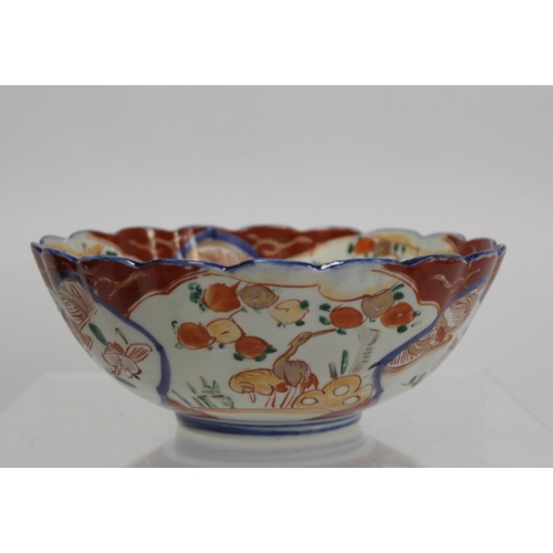 387 - Japanese Meiji period Imari bowl of circular fluted form with circular panel of a vase of flowers su... 