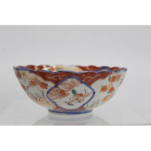 387 - Japanese Meiji period Imari bowl of circular fluted form with circular panel of a vase of flowers su... 