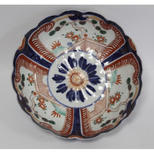 388 - Japanese Meiji period Imari bowl of circular fluted form with central vase of flowers surrounded by ... 