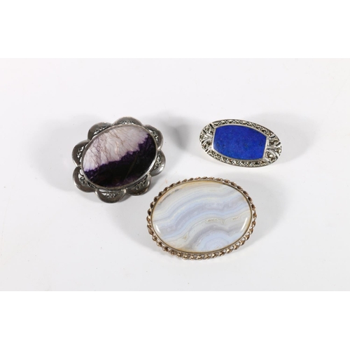 72 - Three silver brooches , one set with Lapis Lauli and marcasite, one set with blue John stone and ano... 