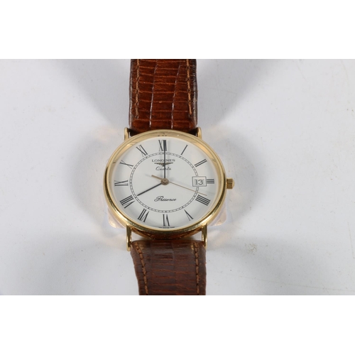 91 - 9ct gold Longines Resence gents wristwatch with leather strap.