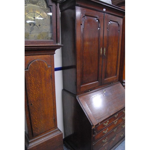 383 - Georgian mahogany bureau cabinet, the cabinet top with two panelled doors enclosing shelves, above a... 