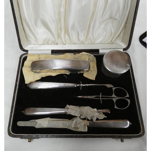 108 - Silver backed manicure set.