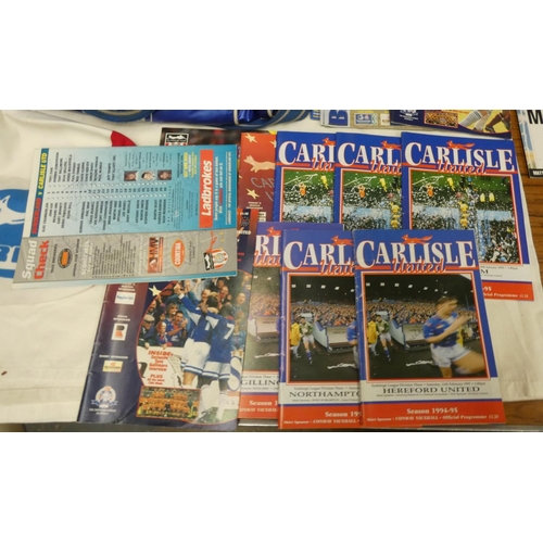 28 - Carlisle United and Manchester United programmes, flag, bag, keyrings, etc.