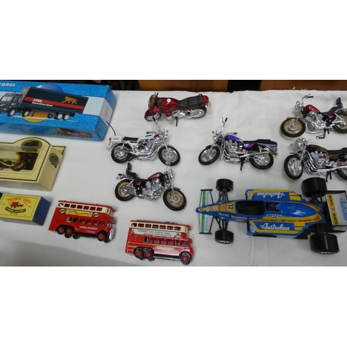 34 - Large box of modern die cast vehicles including motorbikes, cars, boxed Corgi Lynx lorry, etc.