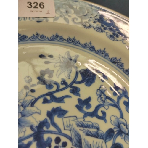 326 - Pair of 18th century Chinese blue and white porcelain plates, the central panels depicting gardens w... 