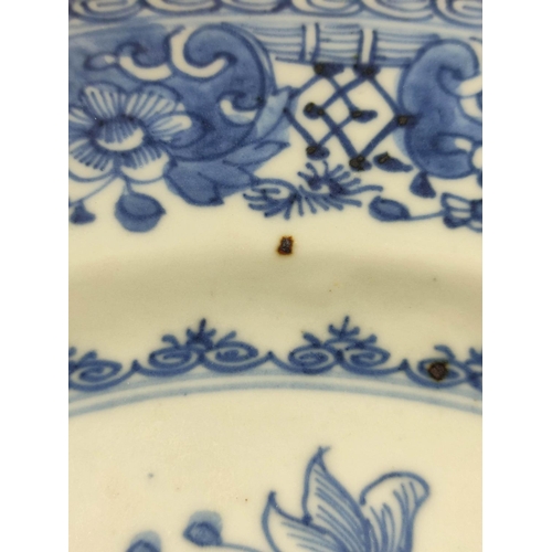 326 - Pair of 18th century Chinese blue and white porcelain plates, the central panels depicting gardens w... 