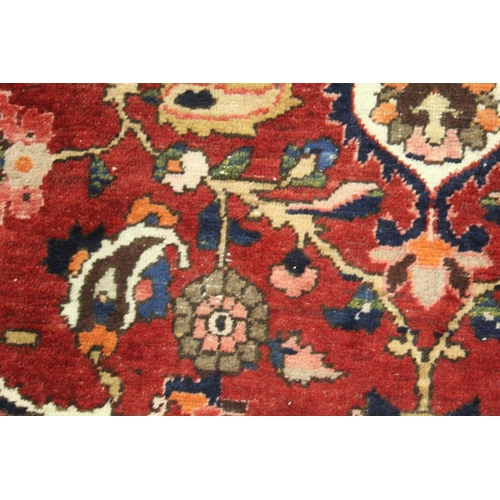 455 - Persian Bahktiari rug, the hand knotted rug with central floral medallion within all over floral mot... 