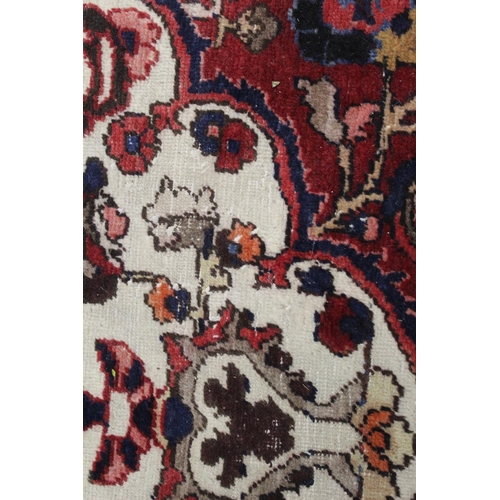 455 - Persian Bahktiari rug, the hand knotted rug with central floral medallion within all over floral mot... 