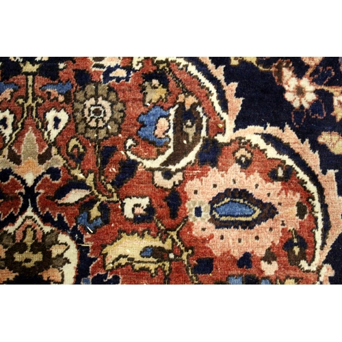 455 - Persian Bahktiari rug, the hand knotted rug with central floral medallion within all over floral mot... 