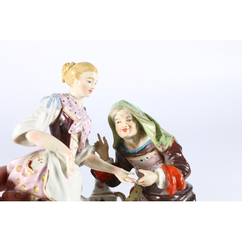 1 - Antique German porcelain figure group modelled as a fortune teller palm reading a lady with a cherub... 