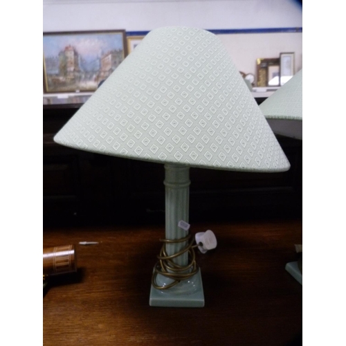 127 - Pair of green pottery table lamps and similar shades.  (2)