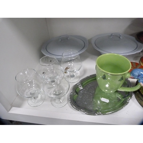 139 - Brass triple stand, collector's plate, Disney novelty mug, glasses etc (one shelf).