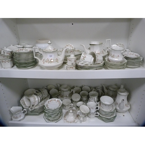 140 - Large collection of Johnson Bros 'Eternal Beau' dinner and teawares (two shelves).