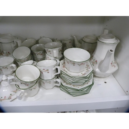 140 - Large collection of Johnson Bros 'Eternal Beau' dinner and teawares (two shelves).