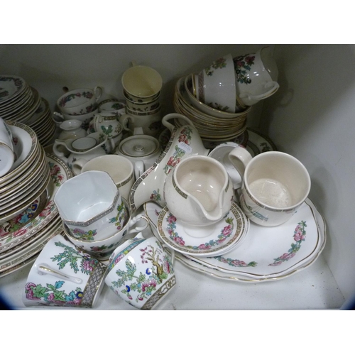 141 - Extensive collection of Indian Tree pattern china (one shelf).