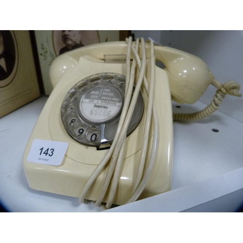 143 - Victorian photograph album, cream telephone, mantel clock and various table linen (one shelf).