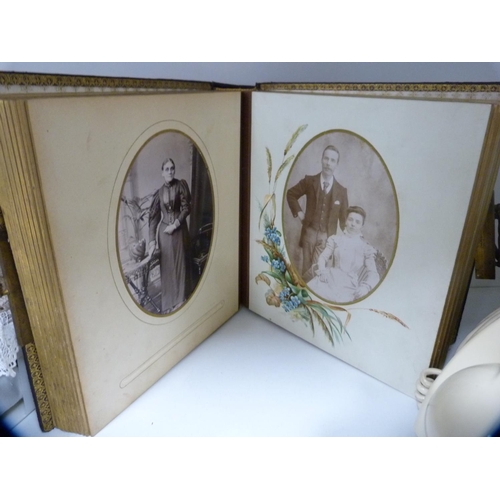 143 - Victorian photograph album, cream telephone, mantel clock and various table linen (one shelf).