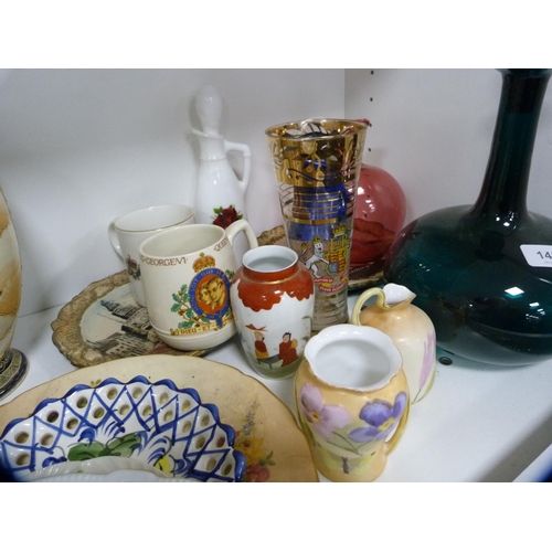 145 - Pair of Satsuma vases, green glass decanter, cranberry glass jug etc (one shelf).