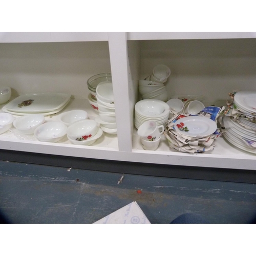 147 - Collection of floral decorated Pyrex dinnerwares (two shelves).