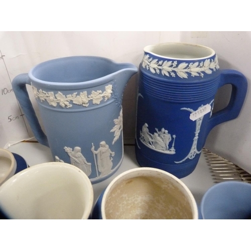 189 - Collection of blue Jasper ware jugs, boxes, dishes etc., some stamped Wedgwood.